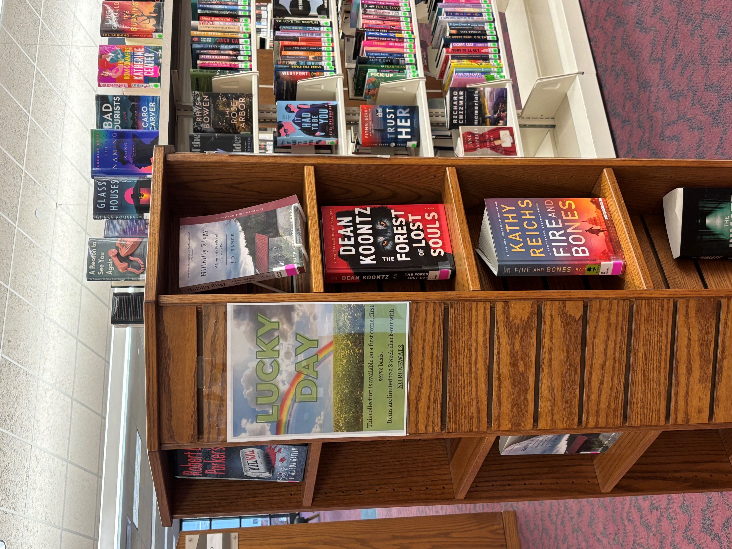 Rotating wooden bookshelf with books